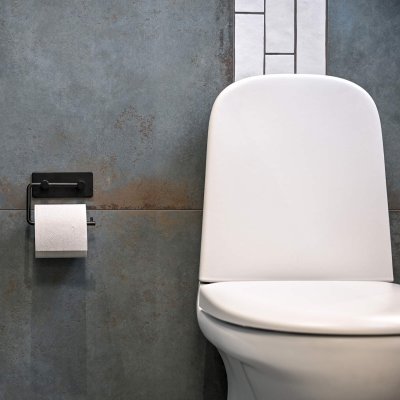 Toiletpapirholder, der monteres med tape