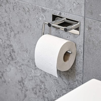 Toiletpapirholder, der monteres med tape
